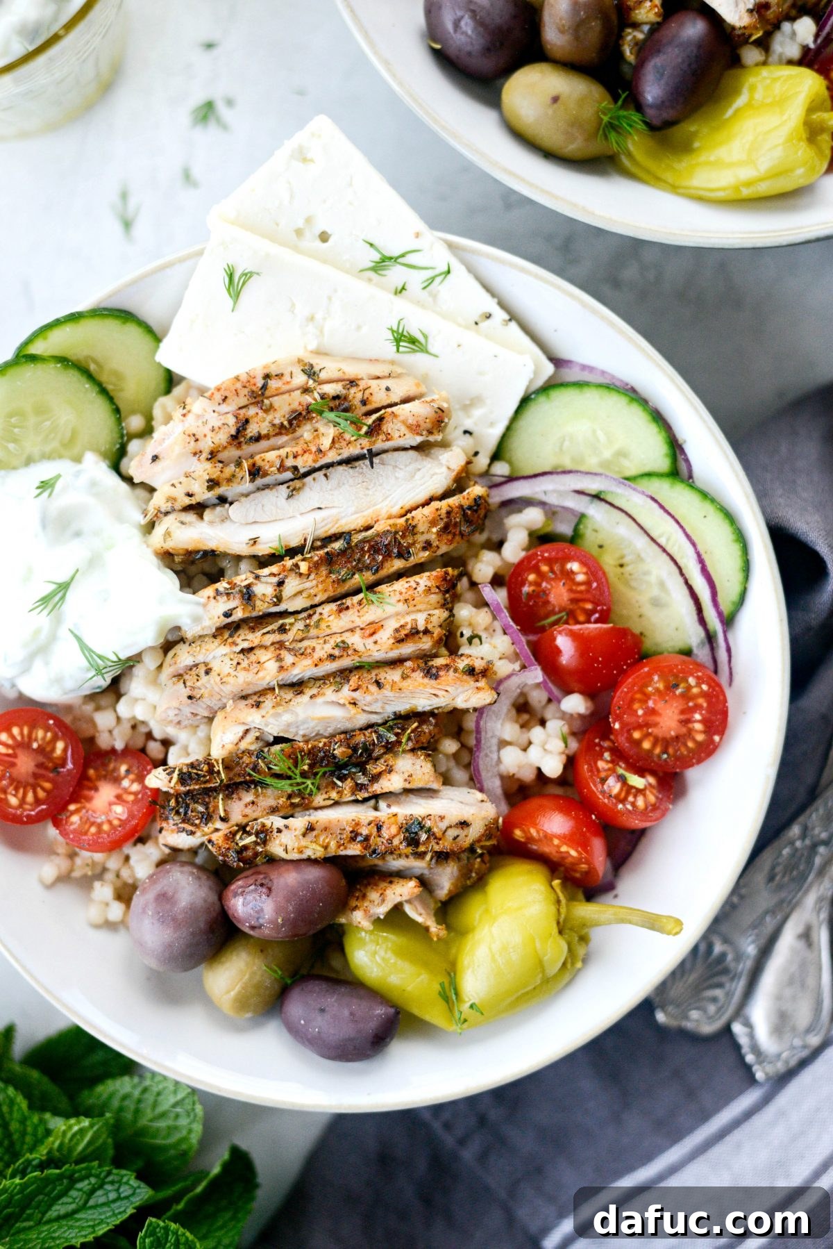 Vibrant Greek Chicken Couscous Bowl 9 Prepared Greek Chicken Couscous Bowls ready to be served