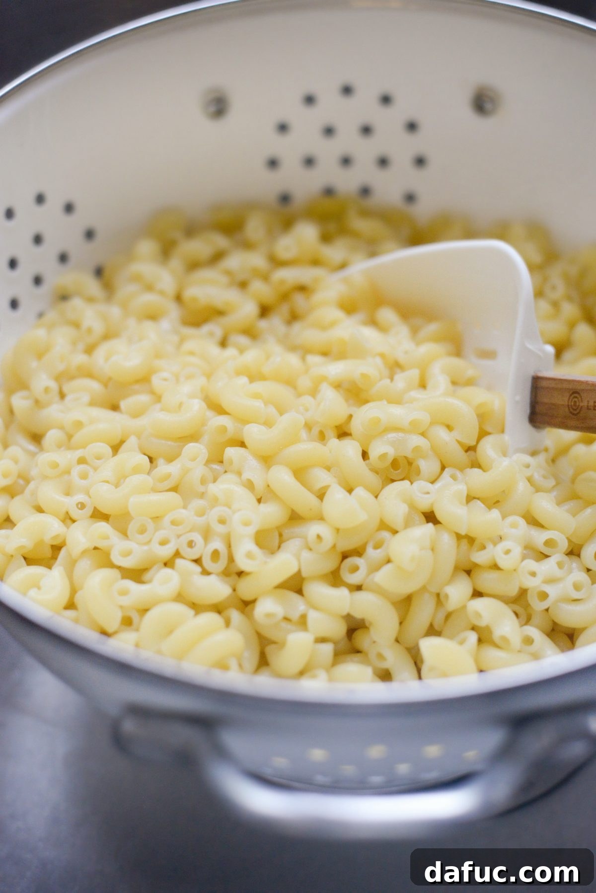 Step-by-step image of cooking macaroni pasta for salad