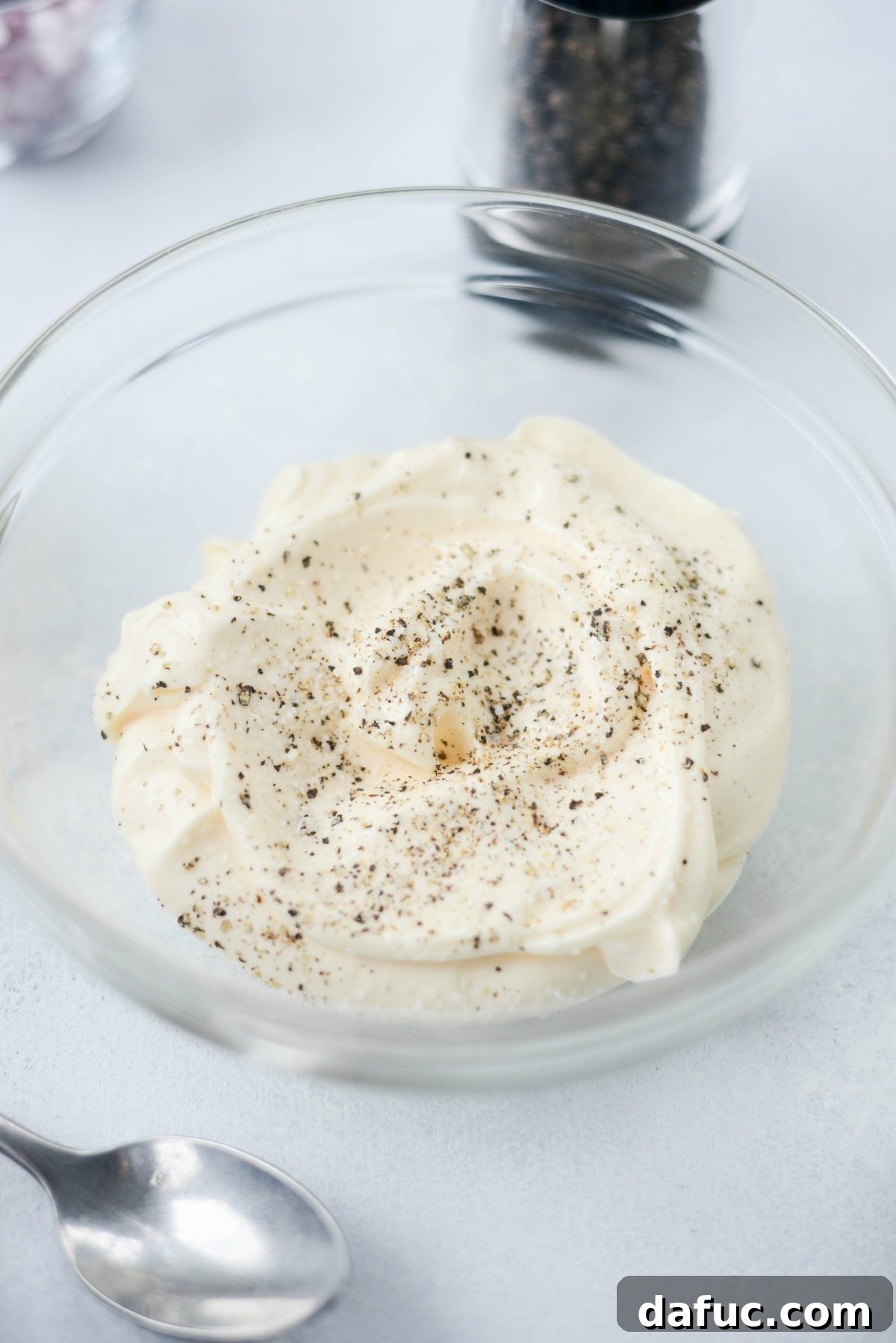Preparing the seasoned mayonnaise dressing for tuna macaroni salad