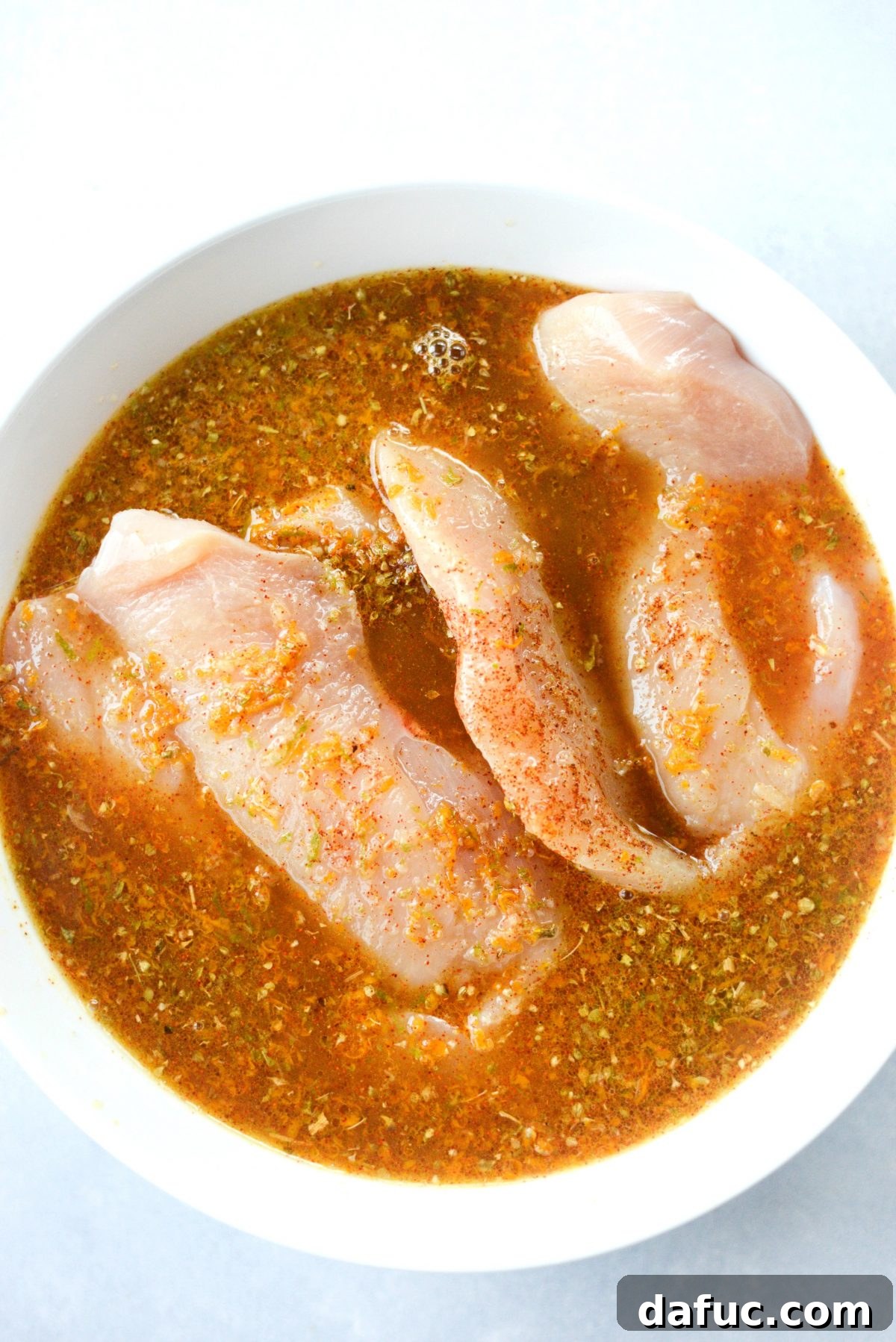 Mojo-Kissed Grilled Chicken with Vibrant Mango Salsa 8 Marinating Chicken in Mojo Sauce