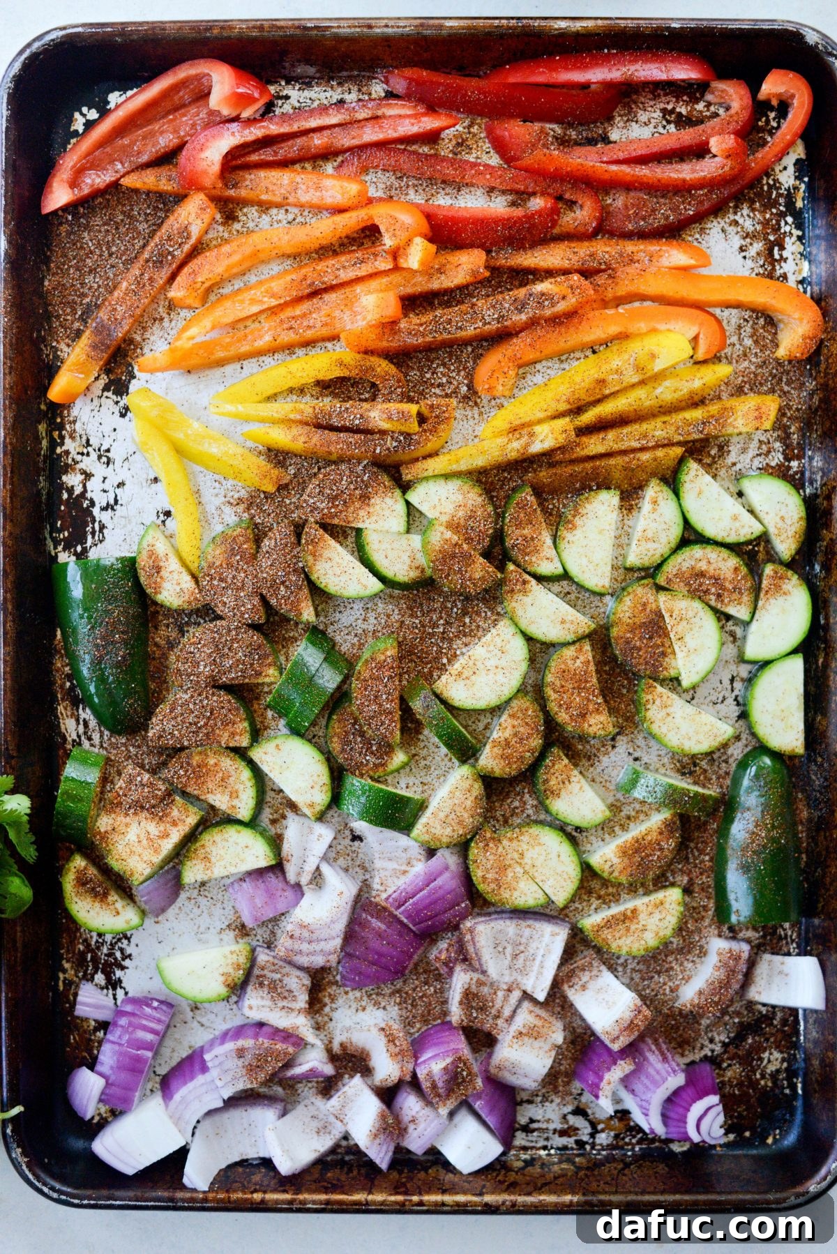 Vibrant Fajita Chicken Quinoa Prep Bowls 6 Seasoned fajita vegetables ready for roasting on a sheet pan