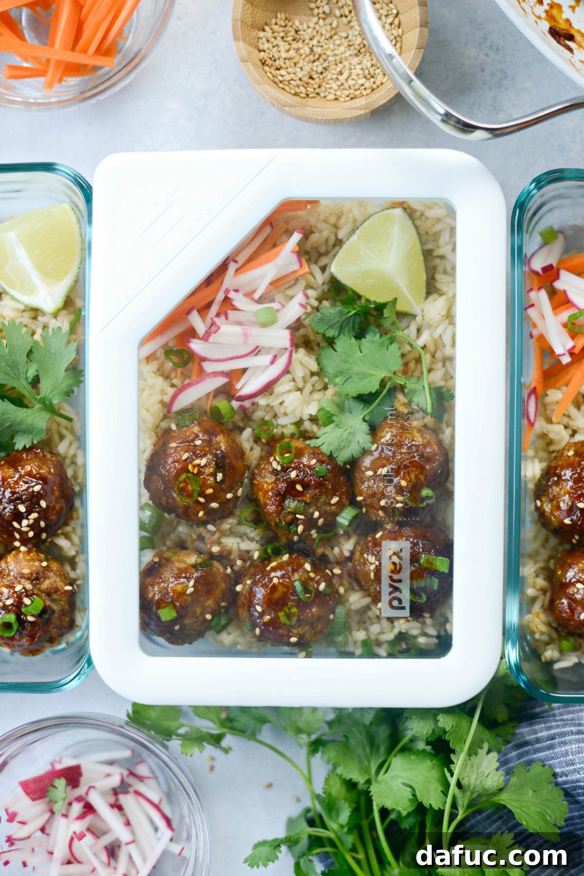 Overhead shot of Maple Sriracha Glazed Meatballs with fresh garnishes