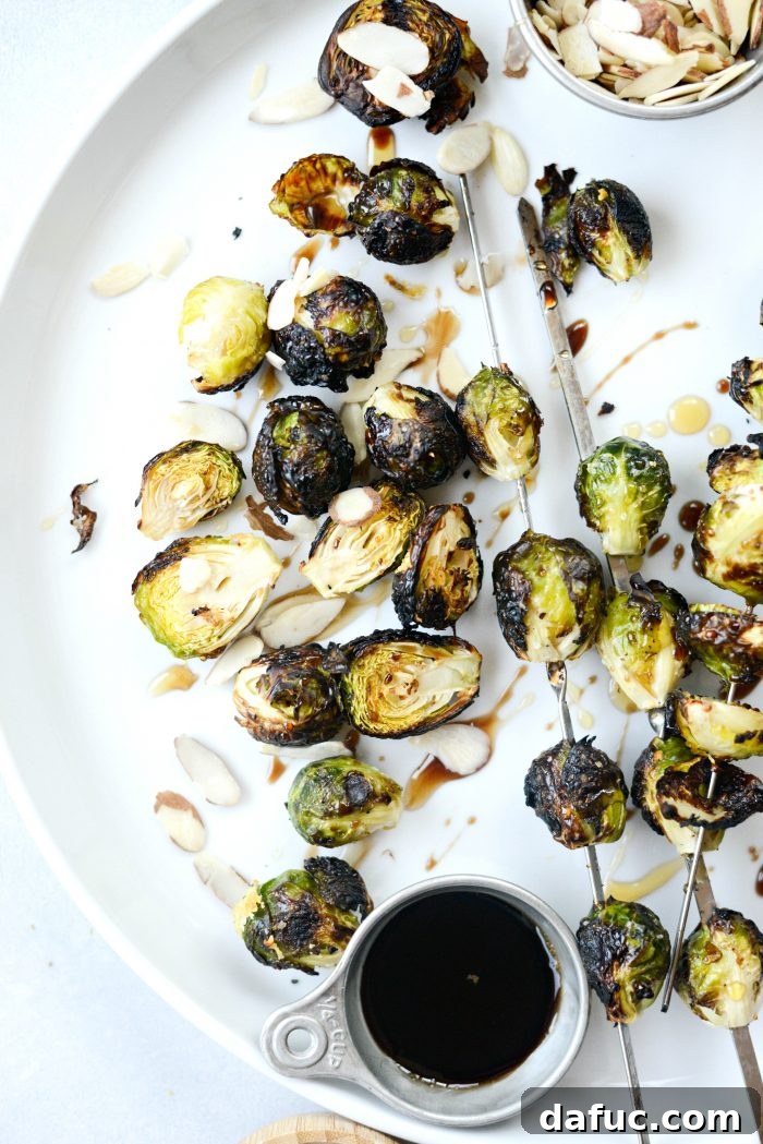 Grilled Garlic Brussels Sprouts artfully arranged on a serving board