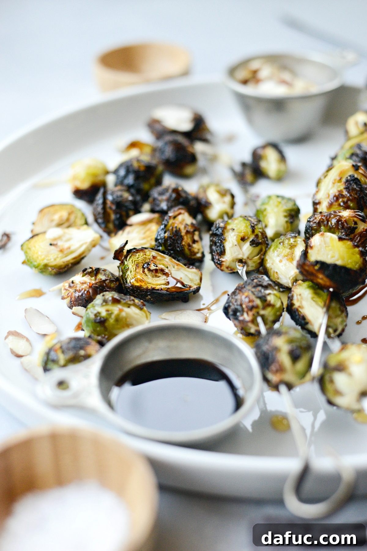 A vibrant platter of Grilled Garlic Brussels Sprouts, ready to be served