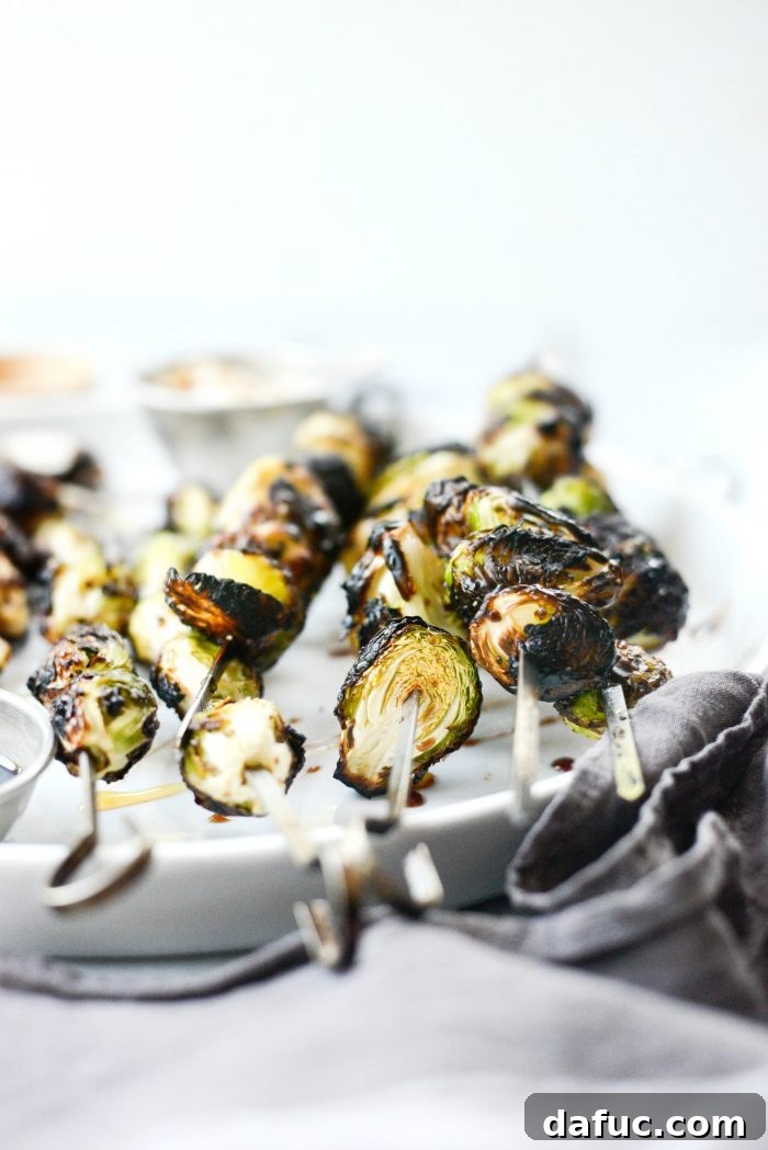 Deliciously Charred Grilled Garlic Brussels Sprouts on a plate