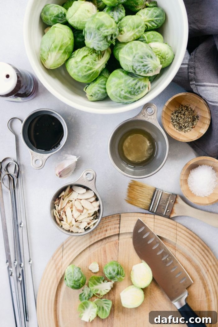 Ingredients for Grilled Garlic Brussels Sprouts including fresh sprouts, olive oil, and garlic