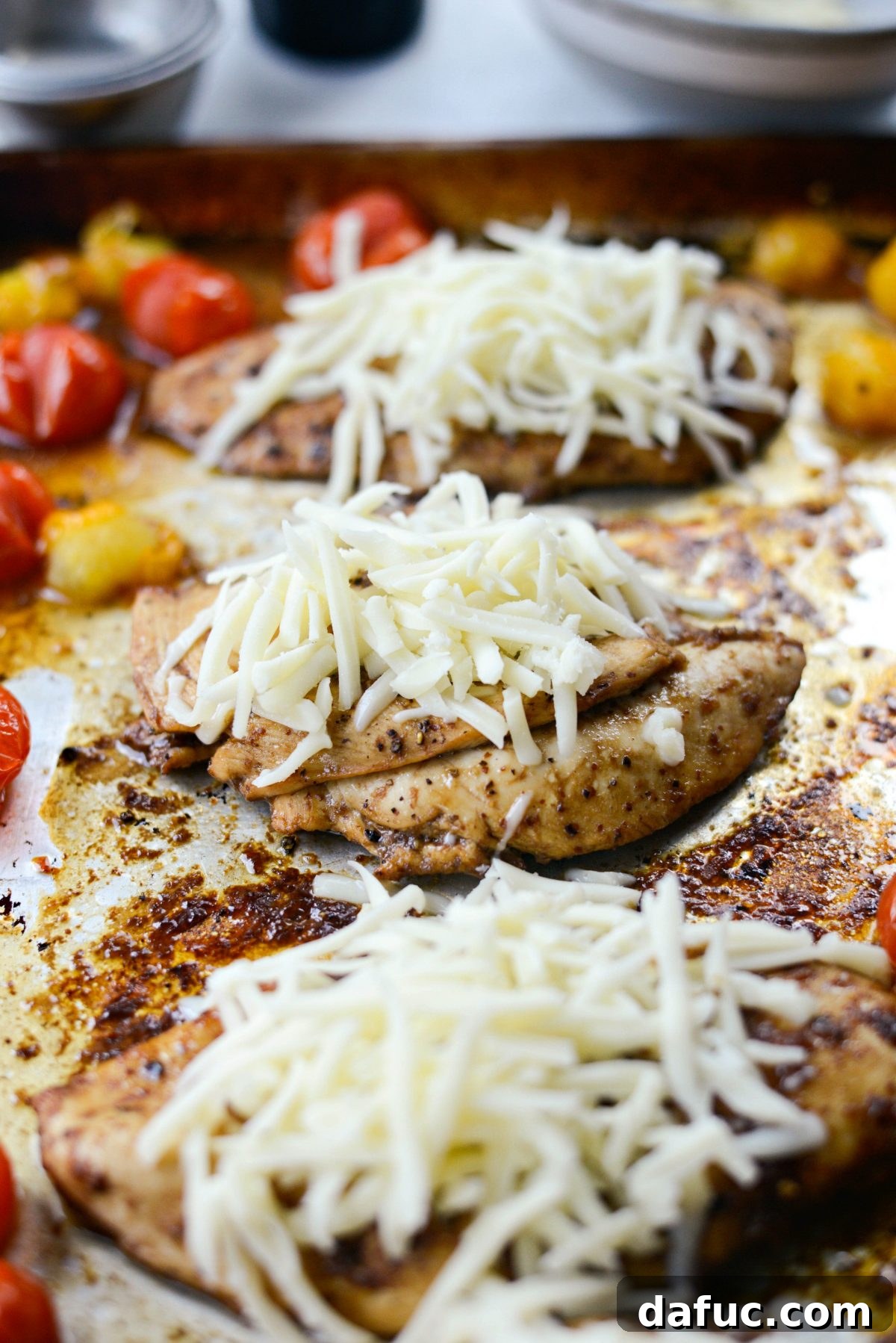 Chicken breasts topped with mozzarella cheese before final bake