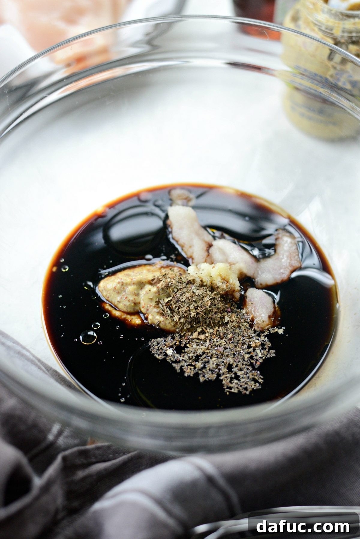 Balsamic basil marinade ingredients being combined