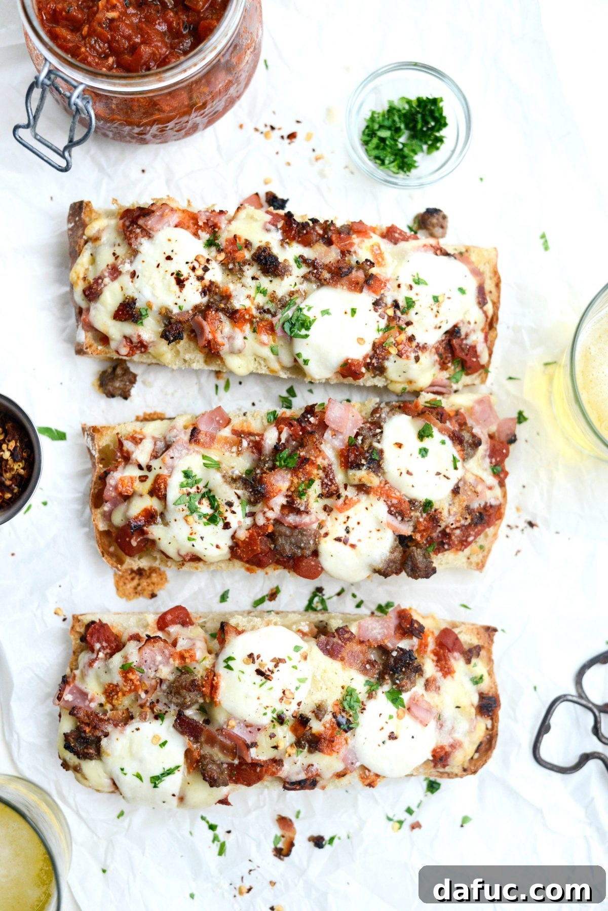 Meat Lovers Ciabatta Pizzas with Mozzarella Bombs sprinkled with pepper flakes and parsley