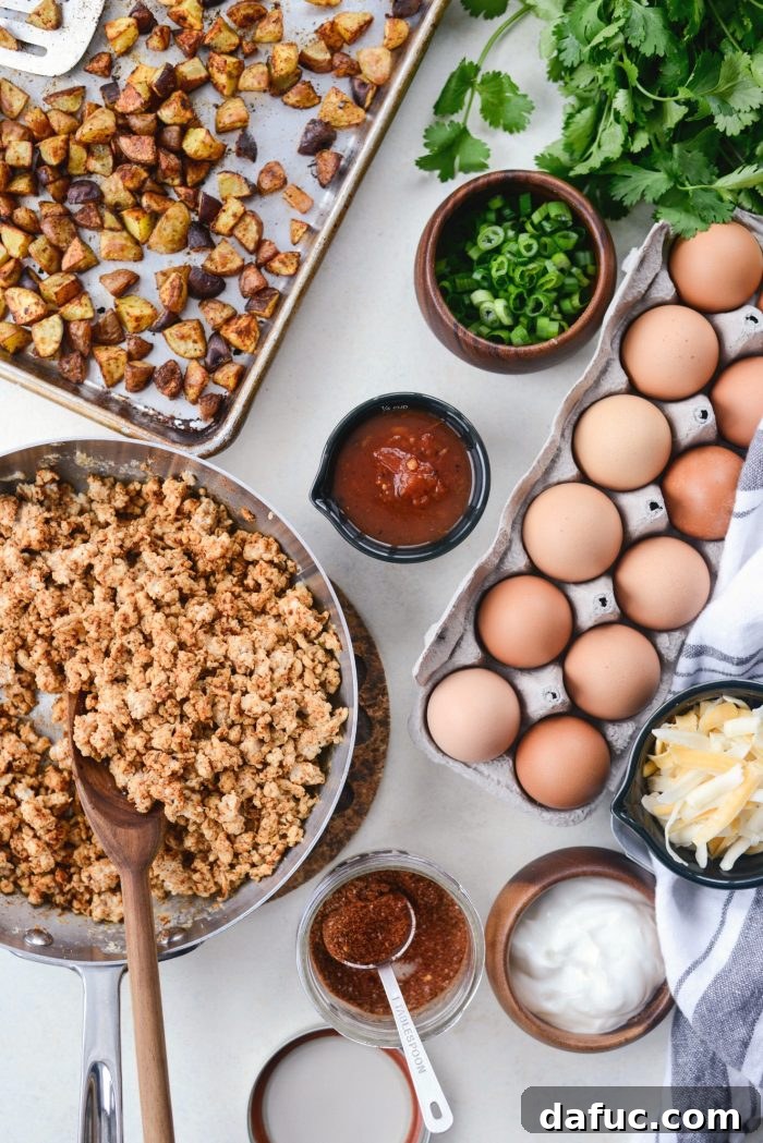Easy Turkey Taco Breakfast Scramble Meal Prep 4 All the fresh ingredients laid out for Turkey Taco Breakfast Scramble prep: potatoes, turkey, eggs, salsa, Greek yogurt, cheese, green onions, and cilantro.