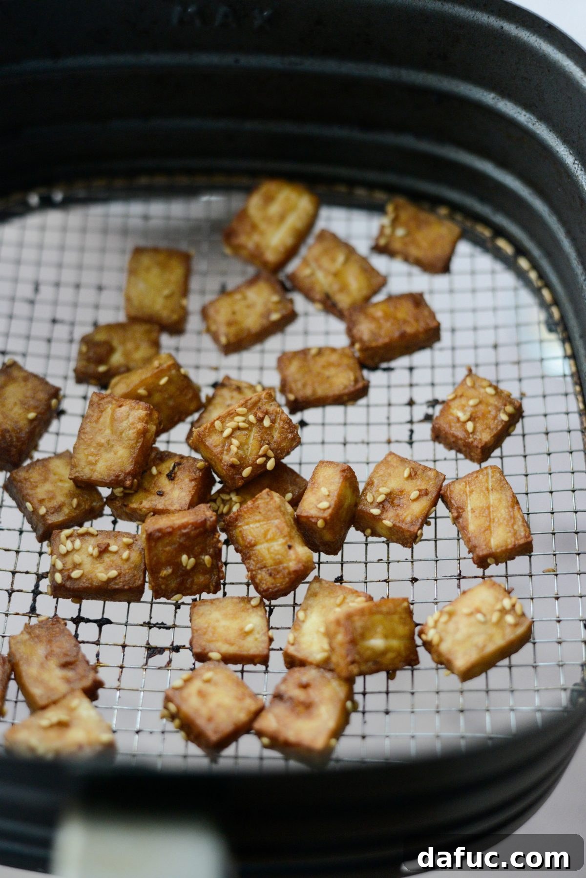 Perfectly Crispy Air Fryer Tofu with Creamy Peanut Sauce 9 Air fried tofu pieces