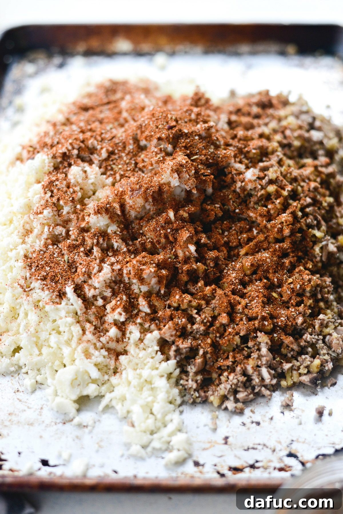 Spiced Cauliflower Taco Crumble 11 Drizzling olive oil and seasoning with taco seasoning on the mixture