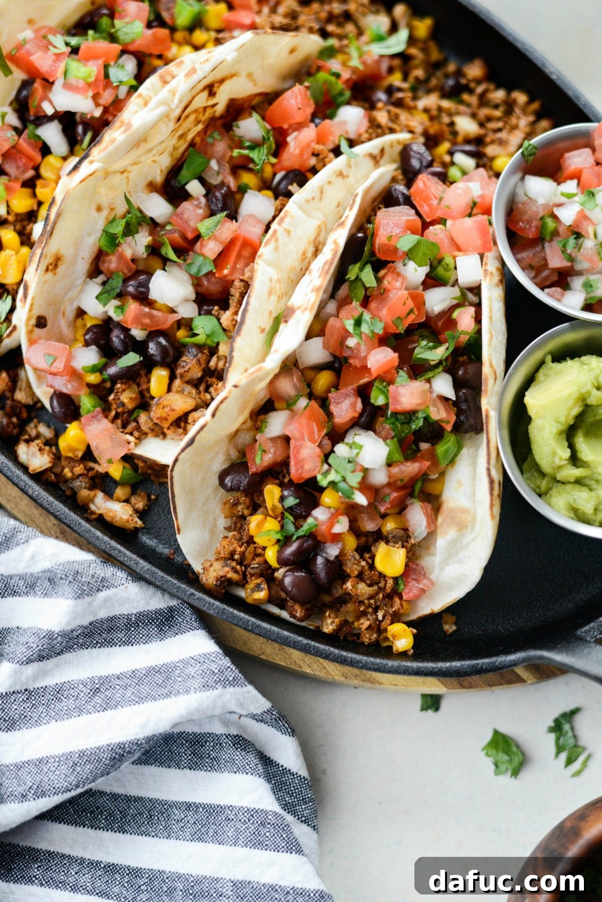 Spiced Cauliflower Taco Crumble 16 Close-up of Vegan Cauliflower Taco Meat in soft tacos with toppings