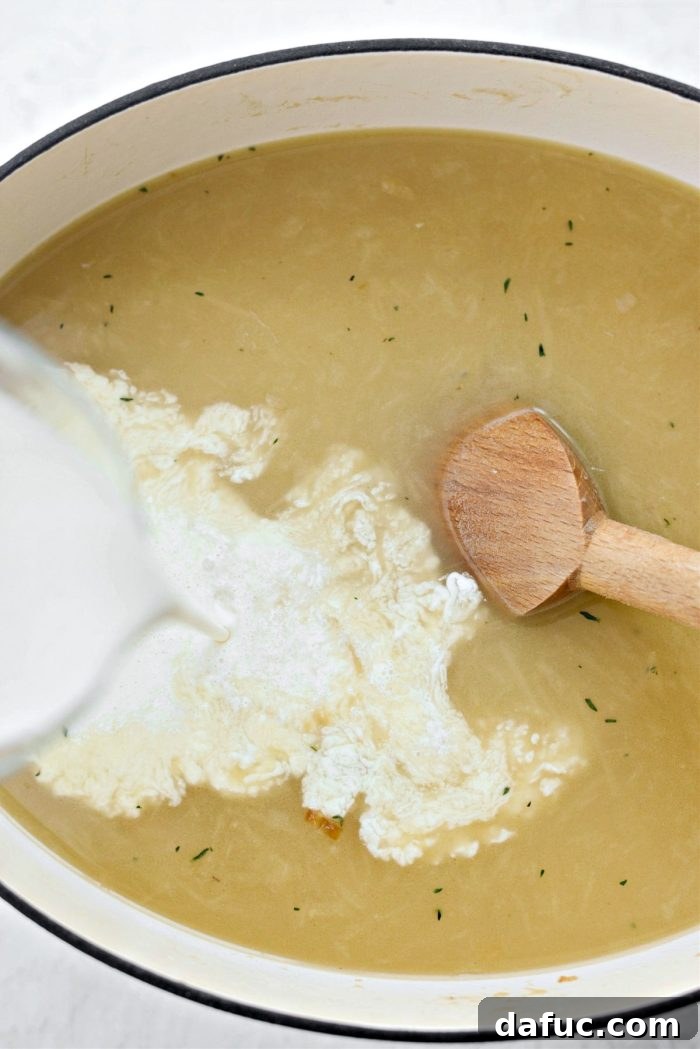Creamy French Onion Chowder 16 Adding heavy cream to the simmering chowder base