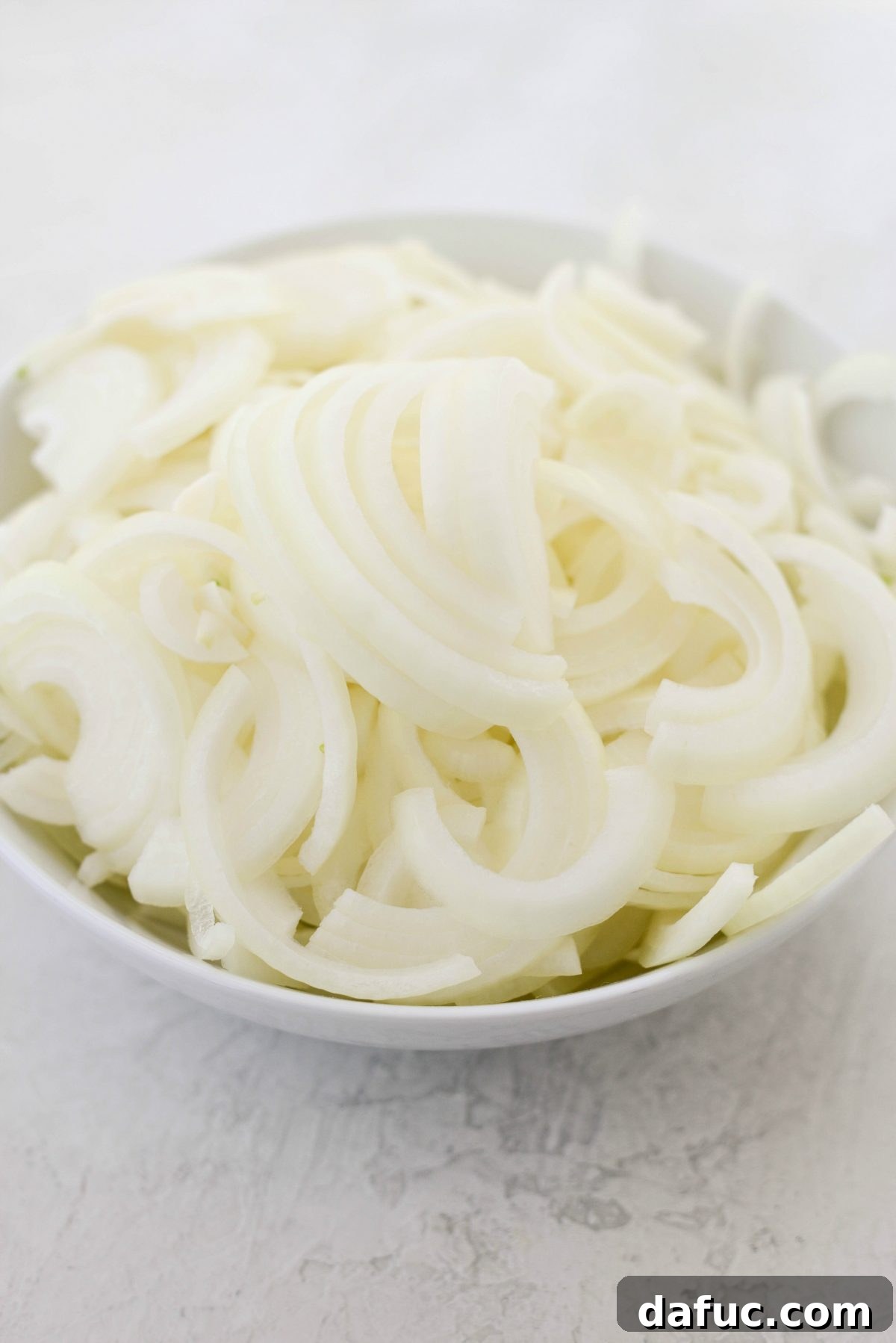 Creamy French Onion Chowder 5 Bowl of thinly sliced sweet onions, prepared for cooking