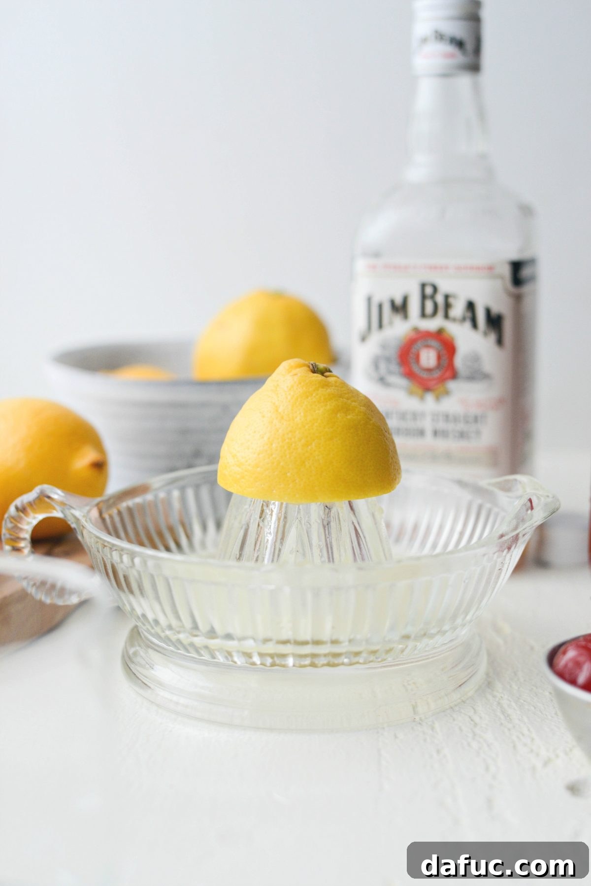 Golden Glow Whiskey Sour 5 juicing a lemon