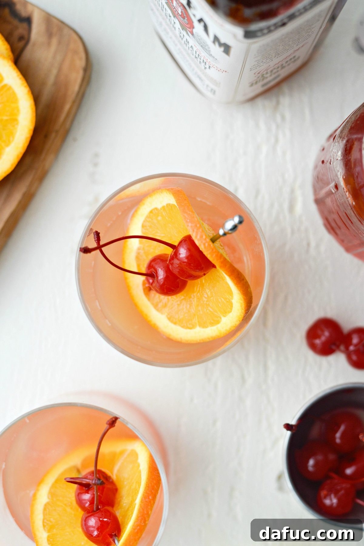 Golden Glow Whiskey Sour 10 garnish a Whiskey Sour Sunrise with an orange slice and two cherries