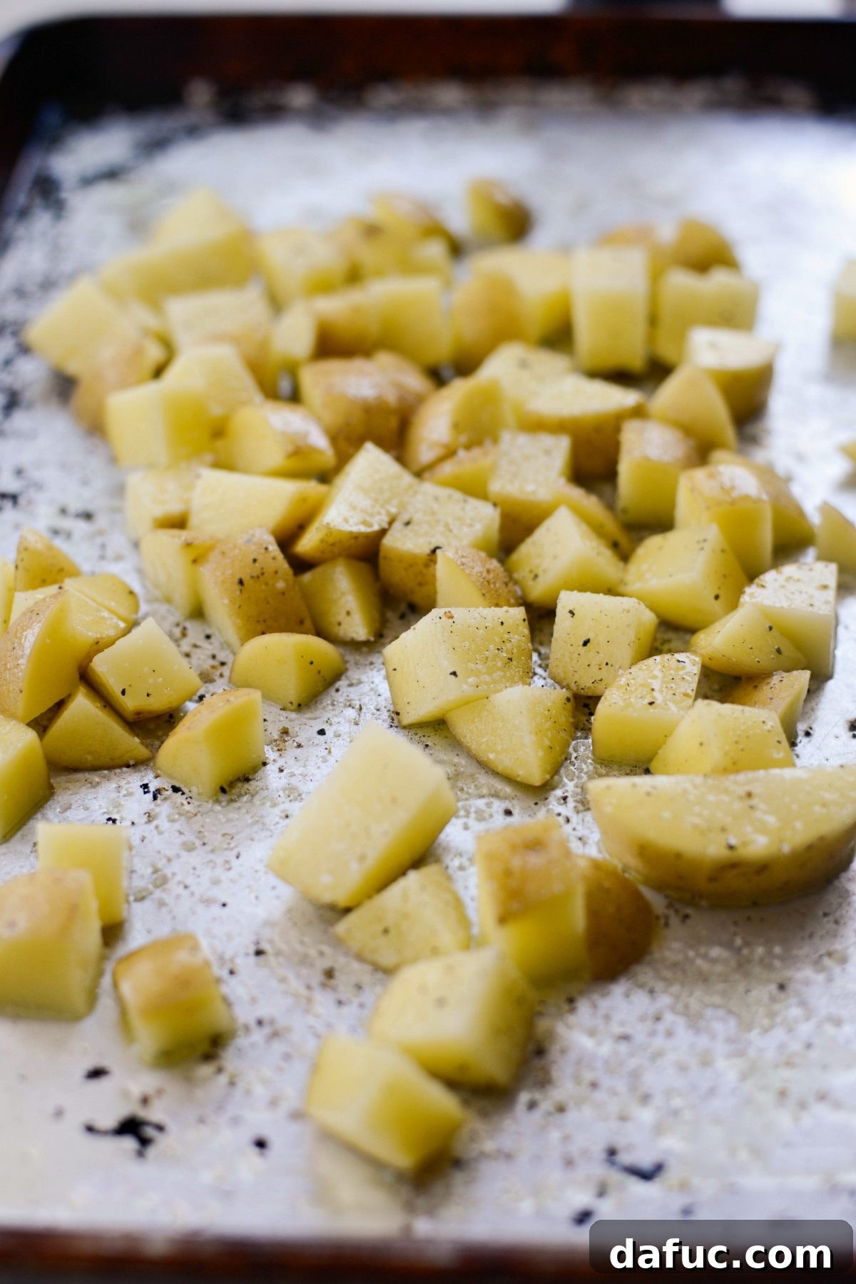season potatoes and toss in oil.