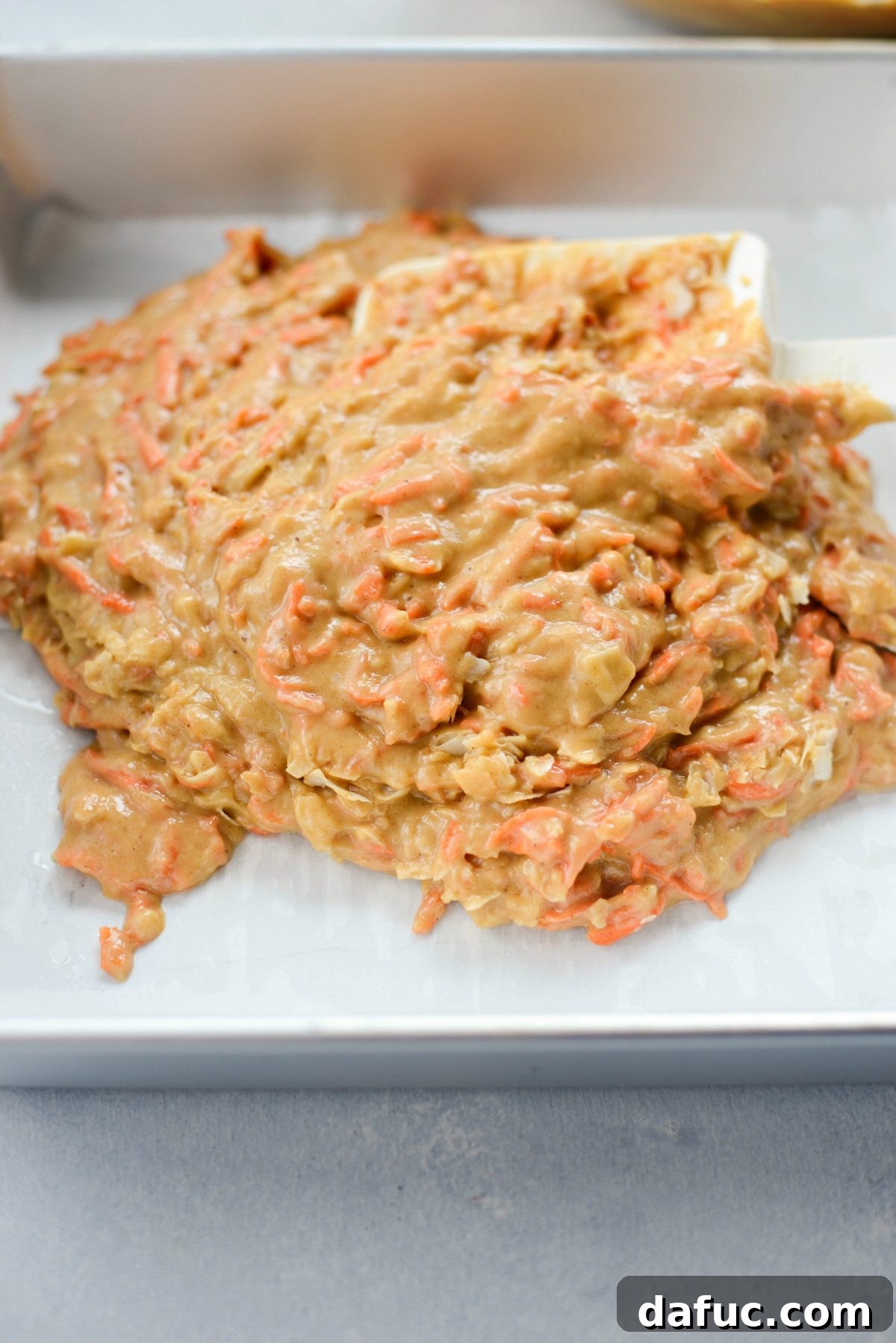 Warmly Spiced Coconut Chai Carrot Cake with Mascarpone Frosting 13 Add batter to prepared cake pan.