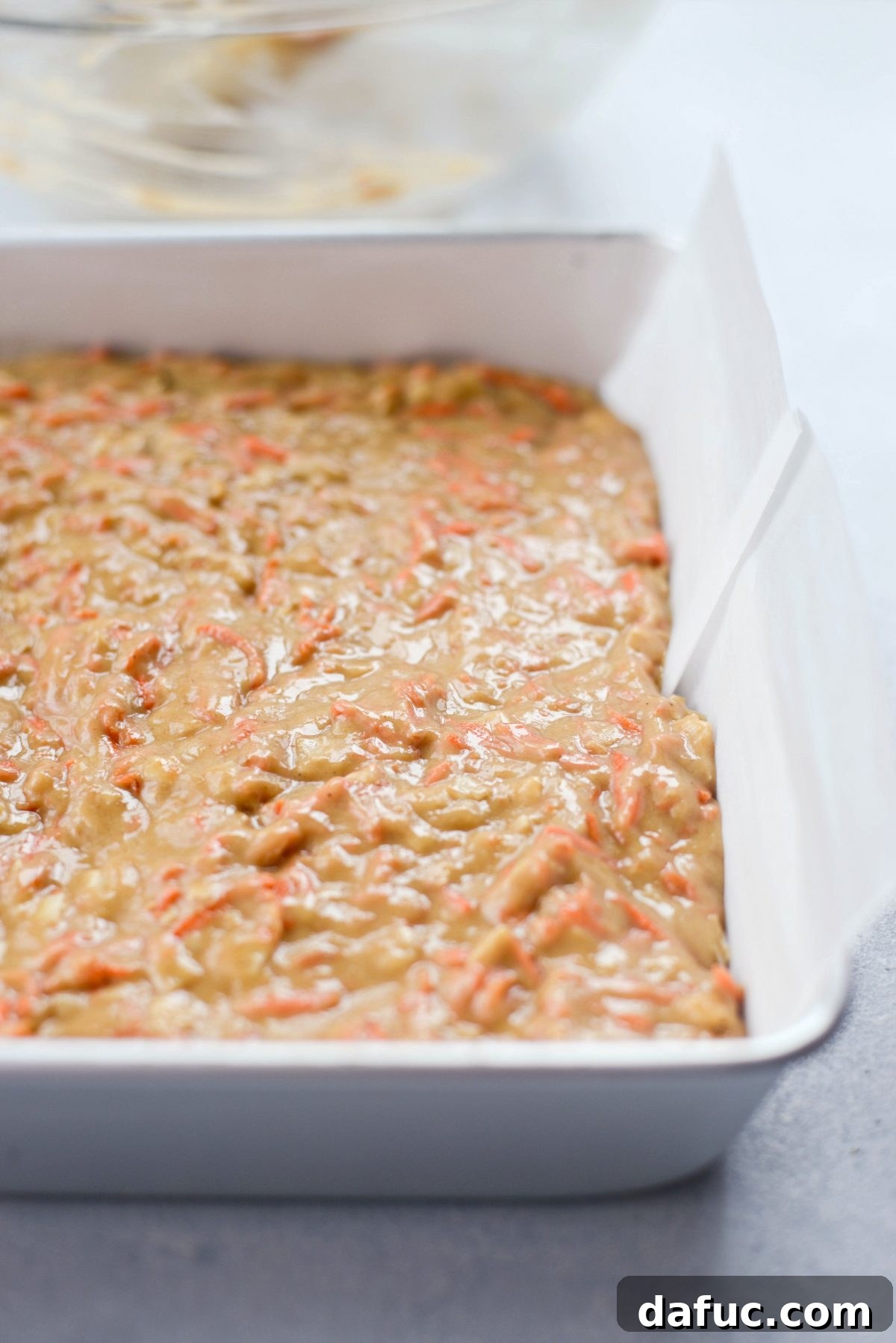 Warmly Spiced Coconut Chai Carrot Cake with Mascarpone Frosting 14 spread evenly.