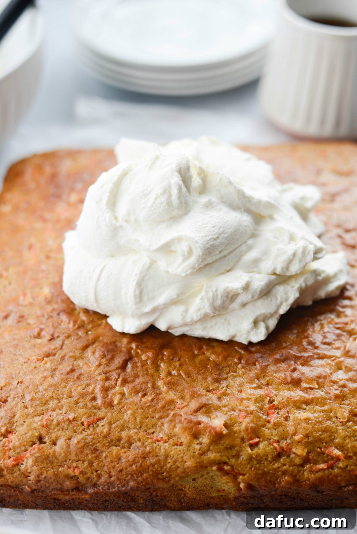 Warmly Spiced Coconut Chai Carrot Cake with Mascarpone Frosting 23 Add frosting to top of cooled cake.