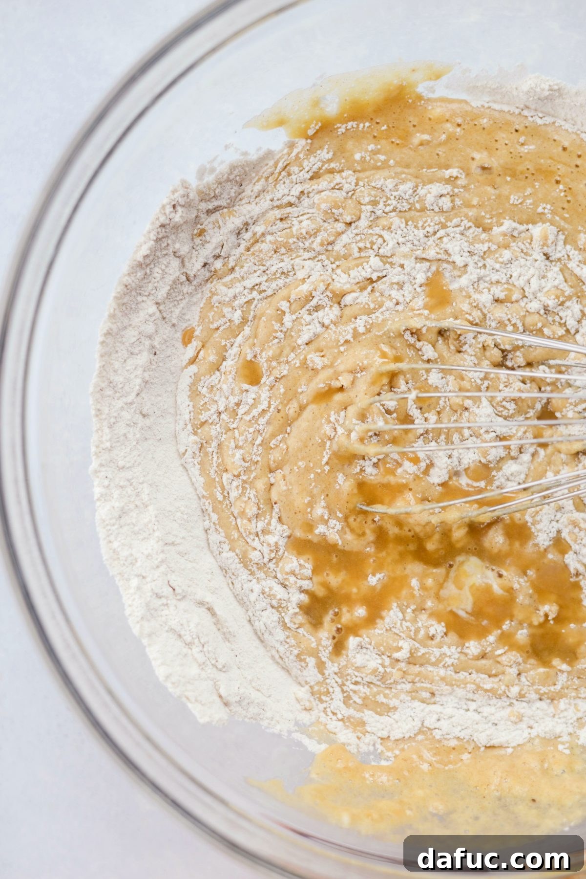 Warmly Spiced Coconut Chai Carrot Cake with Mascarpone Frosting 9 combine wet and dry ingredients.