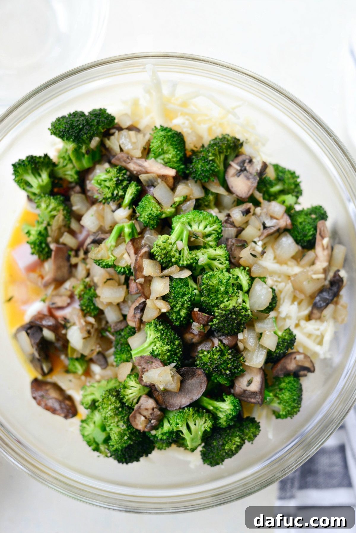 Wholesome Ham, Swiss and Broccoli Quiche 14 Adding sautéed broccoli, onions, and mushrooms to the egg mixture