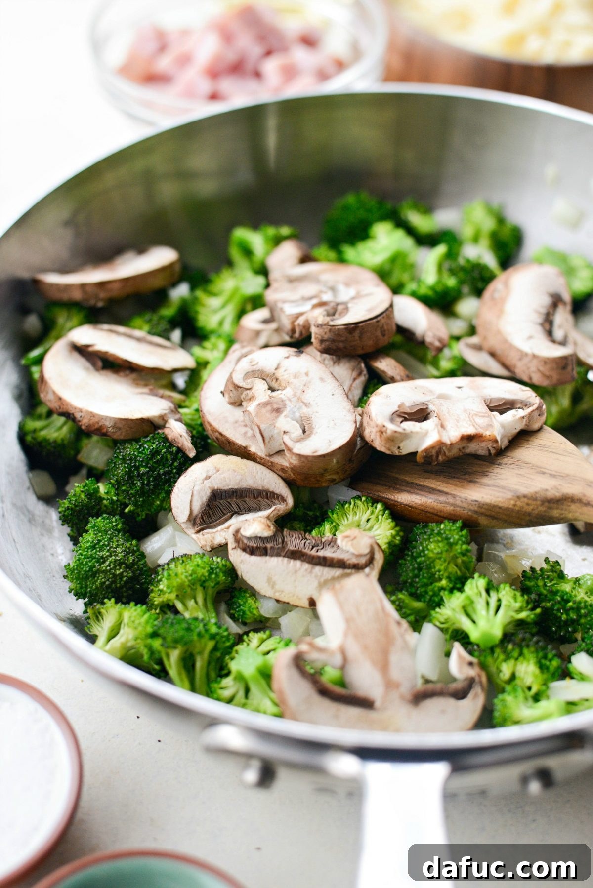 Wholesome Ham, Swiss and Broccoli Quiche 7 Adding sliced mushrooms to the skillet with sautéed broccoli and onions