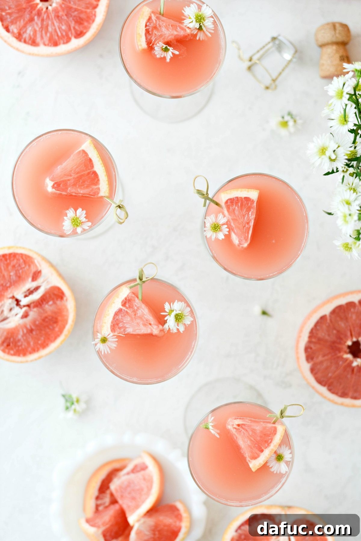 Effervescent Rosé Grapefruit Delight 3 Grapefruit Rosé Mimosas ready for a festive celebration