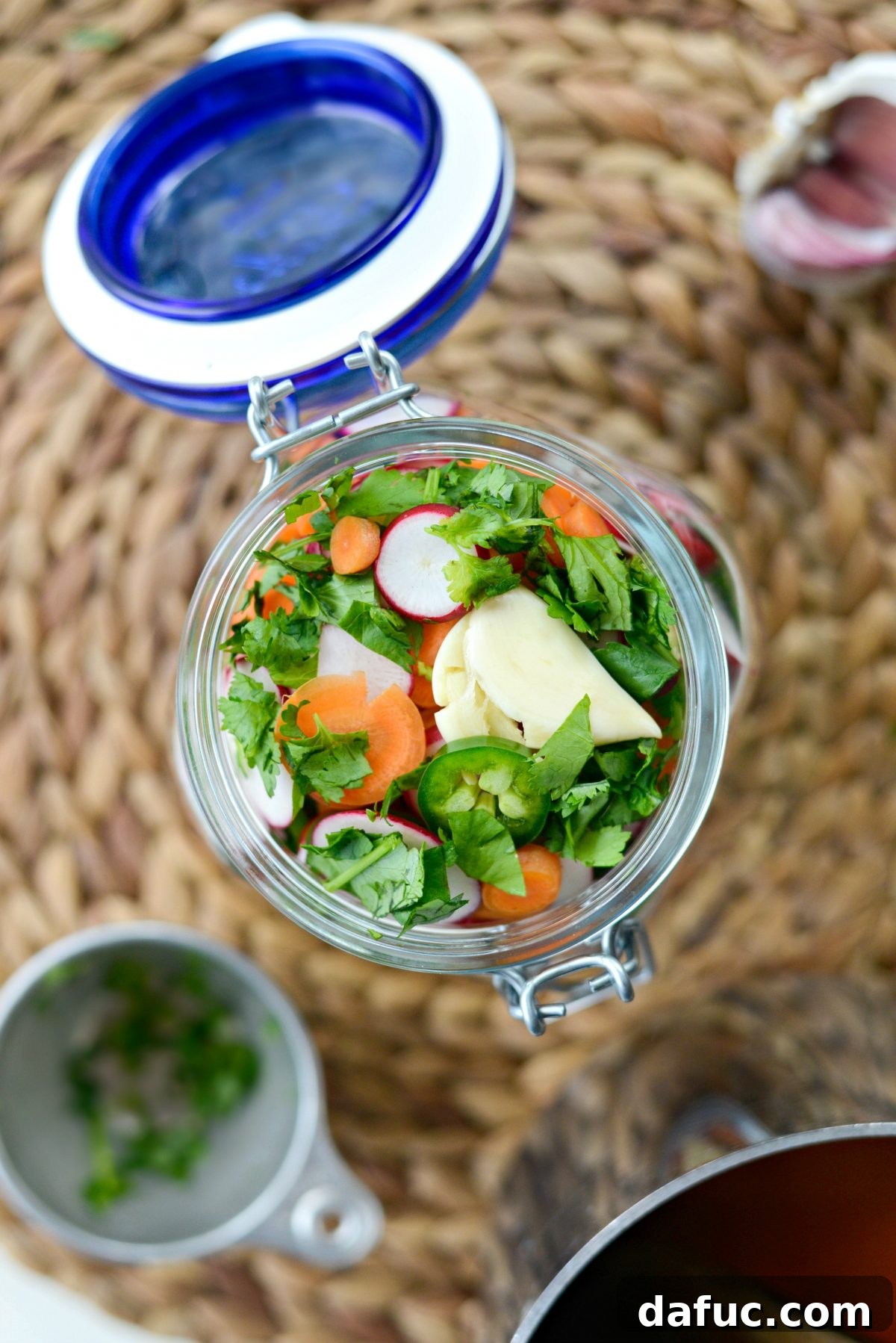 Fermented Firecrackers 9 Combining Sliced Vegetables, Garlic, and Cilantro in a Large Jar