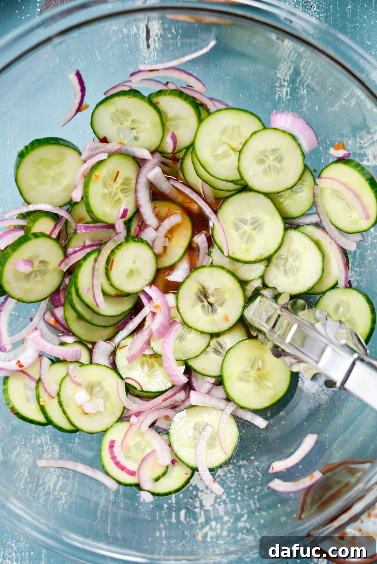 Pickled cucumber and onion slices softening in the flavorful dressing