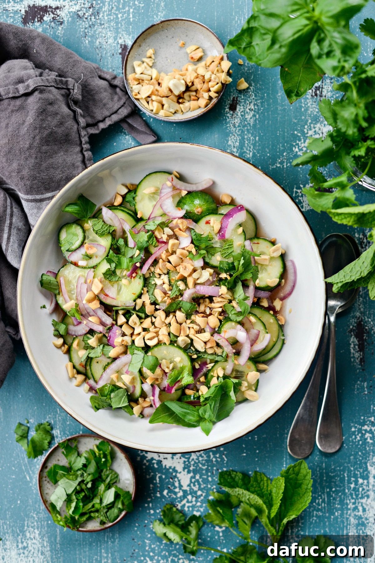 Final presentation of Thai Cucumber Salad, garnished with fresh herbs and peanuts