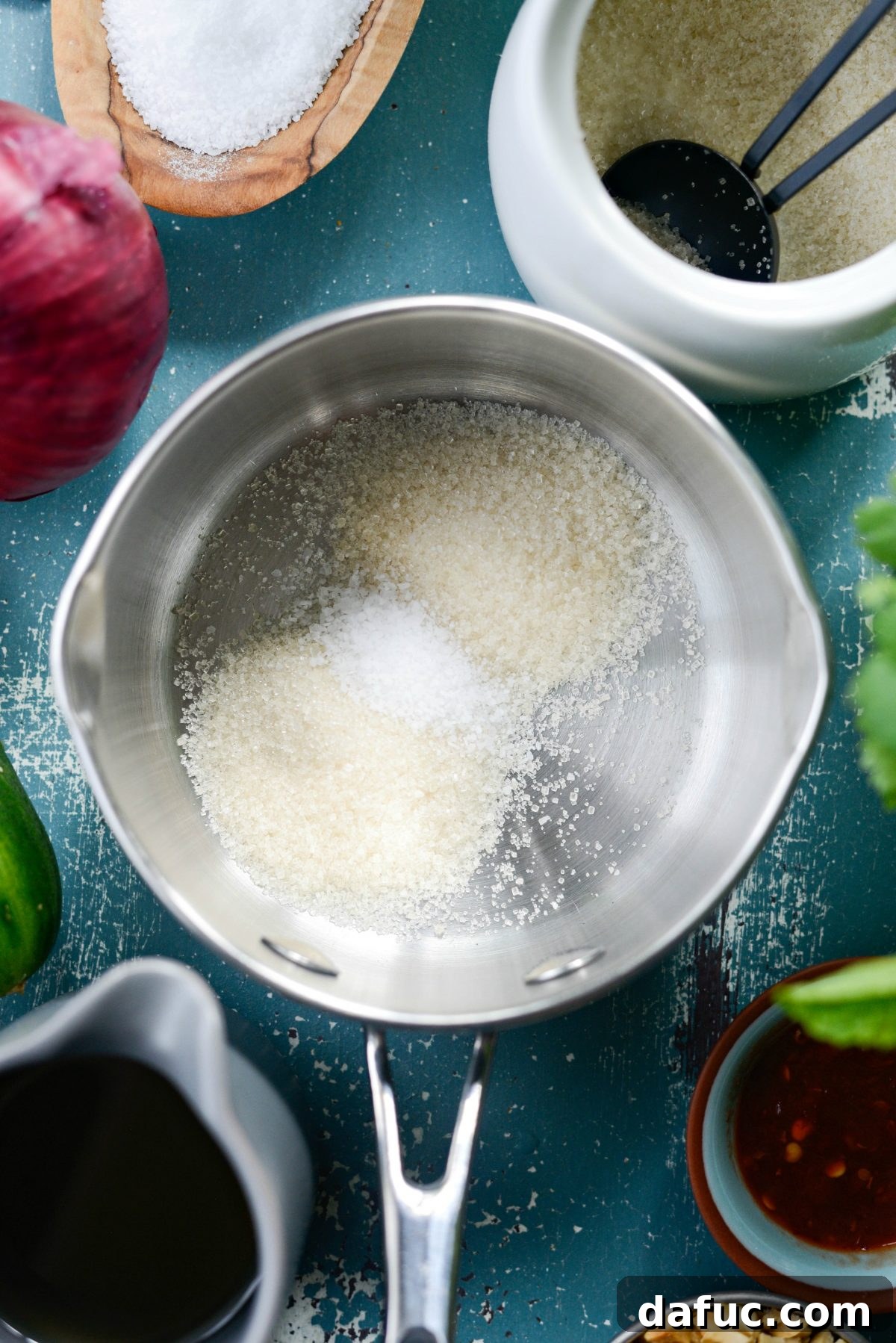 Sugar and salt measured in a small saucepan, ready for the vinegar syrup