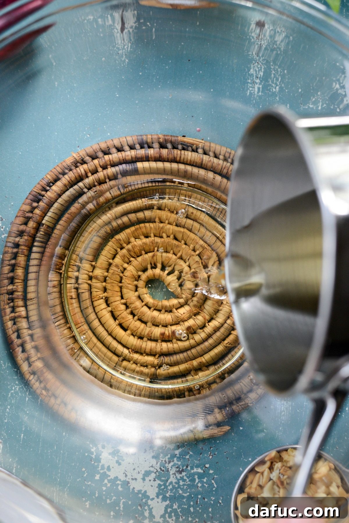 Transferring the cooled vinegar syrup into a mixing bowl