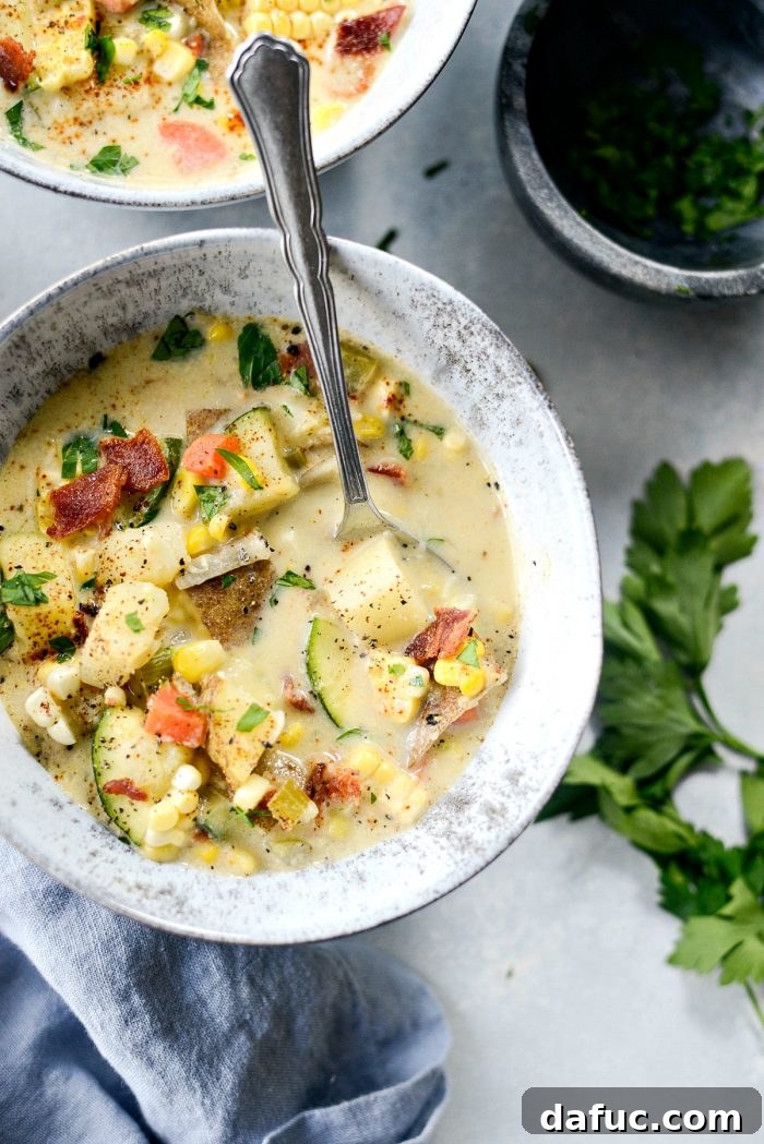 Golden Harvest Corn and Zucchini Chowder 2 A beautiful bowl of creamy Summer Corn and Zucchini Chowder with fresh herbs, ready to be served, showcasing its vibrant ingredients.