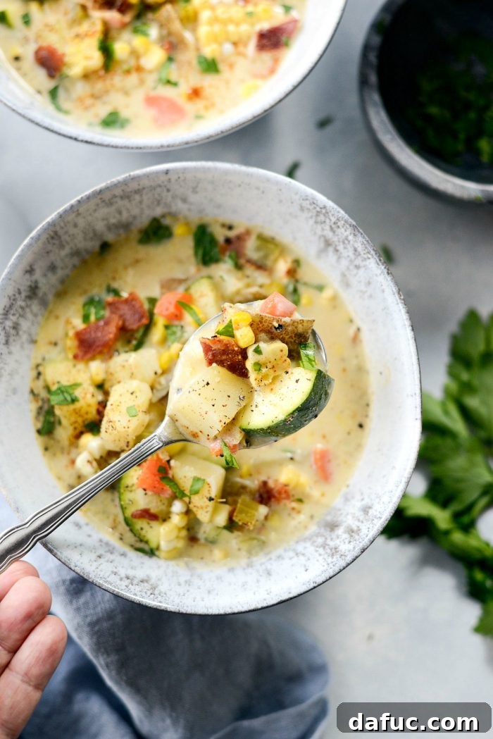 Golden Harvest Corn and Zucchini Chowder 11 Another appealing shot of the Summer Corn and Zucchini Chowder, emphasizing its rich, inviting texture and the simple beauty of a home-cooked meal.