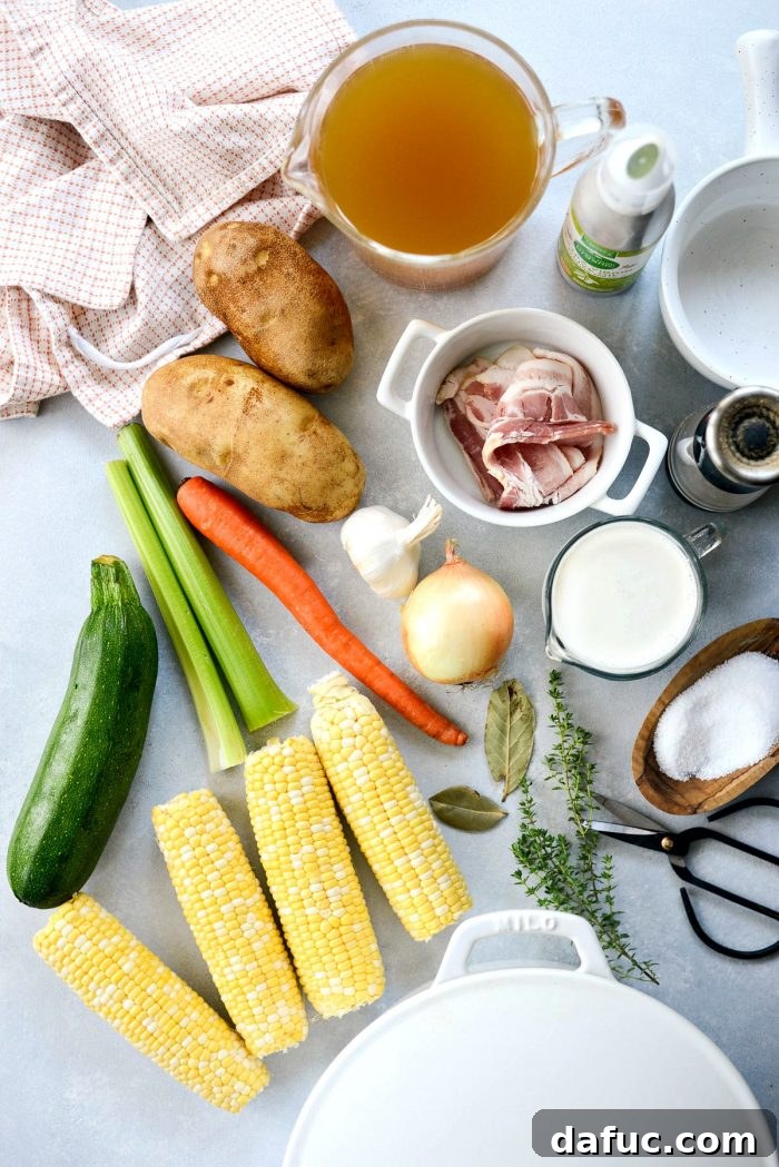 Golden Harvest Corn and Zucchini Chowder 4 A rustic Dutch oven filled with simmering Summer Corn and Zucchini Chowder, capturing the steam and rich texture of the soup.