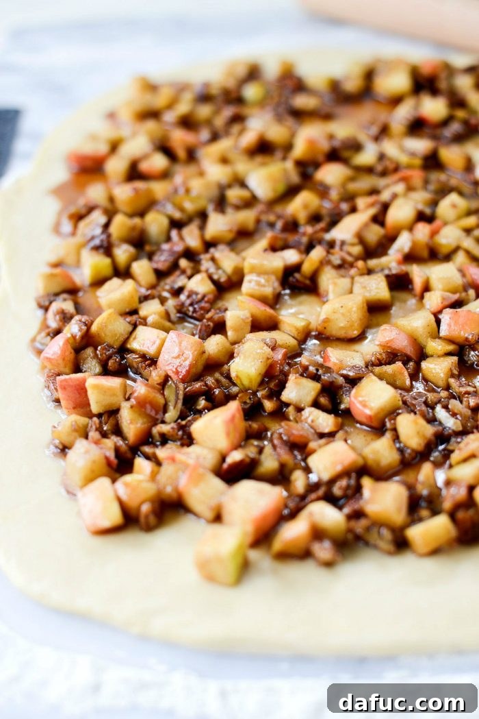Rolling out cinnamon roll dough.