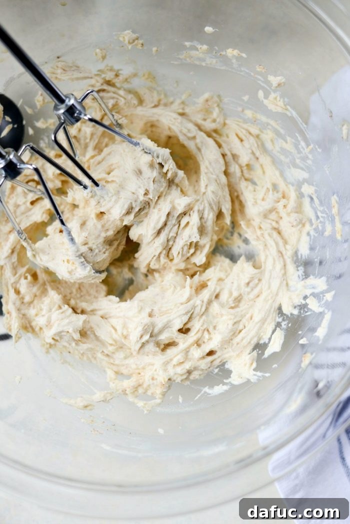 Cream cheese, brown butter, and vanilla in a mixing bowl.