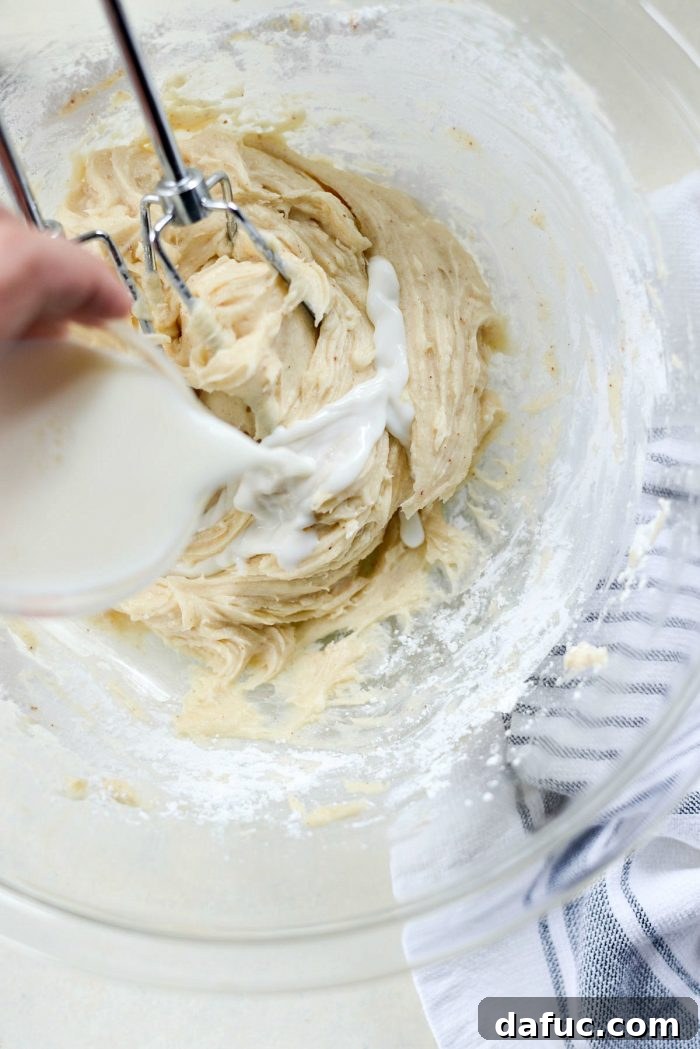 Mixing cream cheese and brown butter until smooth.