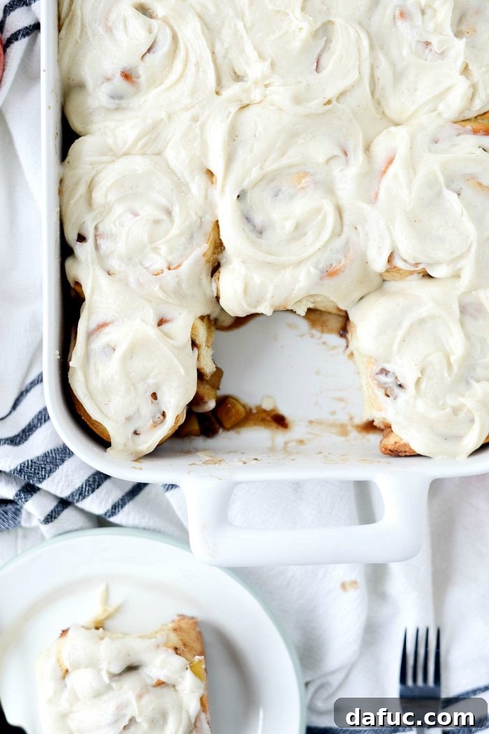A final, enticing image of an Apple Pecan Chai Cinnamon Roll, ready to be enjoyed. SimplyScratch.com