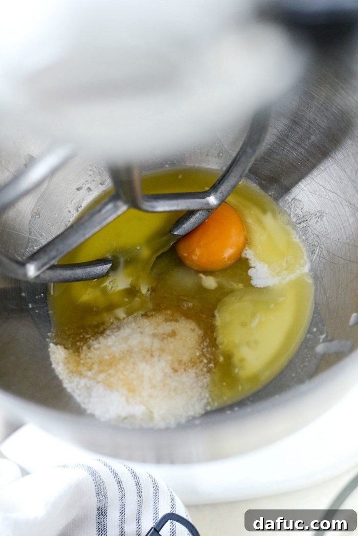 Sprinkling yeast into warm liquid.
