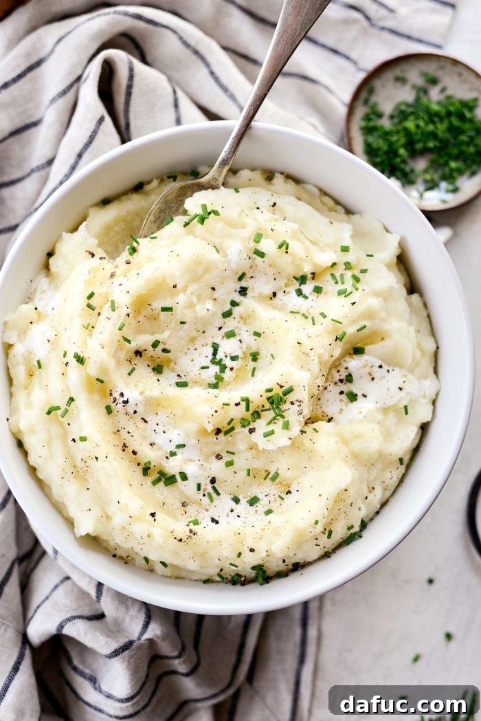 Buttermilk Cauliflower Mashed Potatoes l SimplyScratch.com #cauliflower #mashedpotatoes #potatoes #light #buttermilk #sidedish #homemade #fromscratch #easy