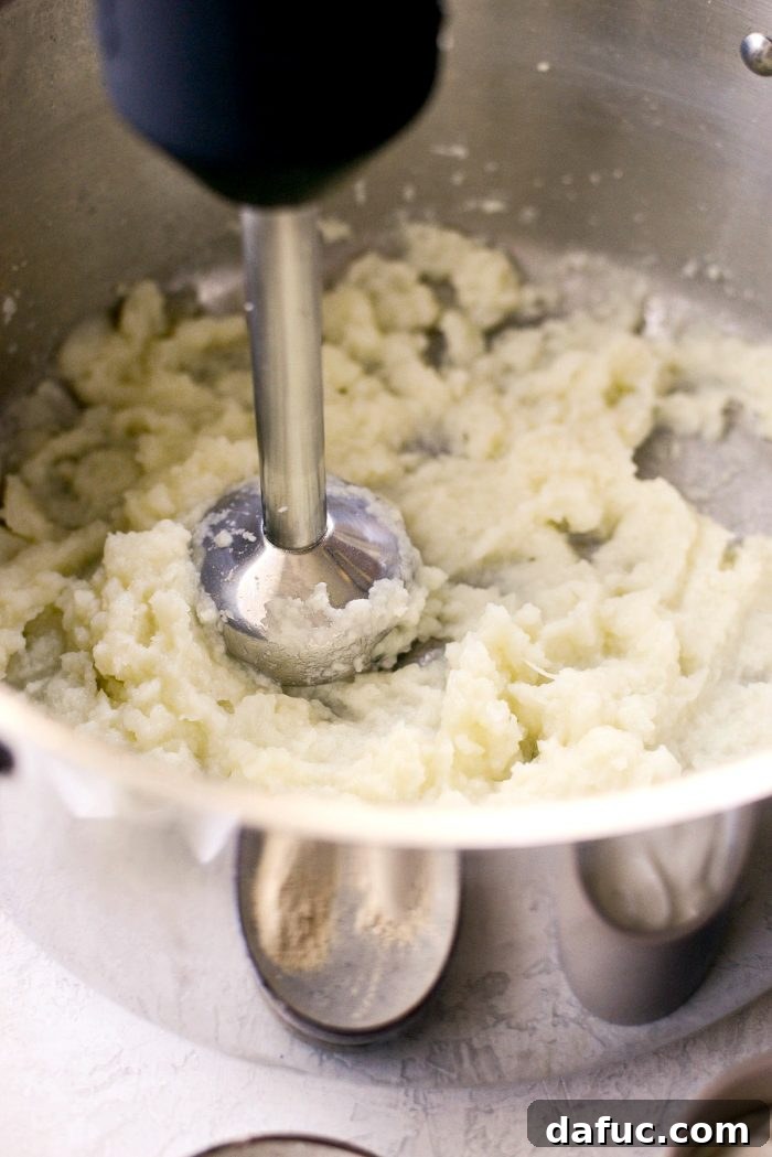 Buttermilk Cauliflower Mashed Potatoes l SimplyScratch.com #cauliflower #mashedpotatoes #potatoes #light #buttermilk #sidedish #homemade #fromscratch #easy