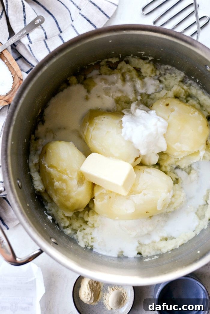 Buttermilk Cauliflower Mashed Potatoes l SimplyScratch.com #cauliflower #mashedpotatoes #potatoes #light #buttermilk #sidedish #homemade #fromscratch #easy