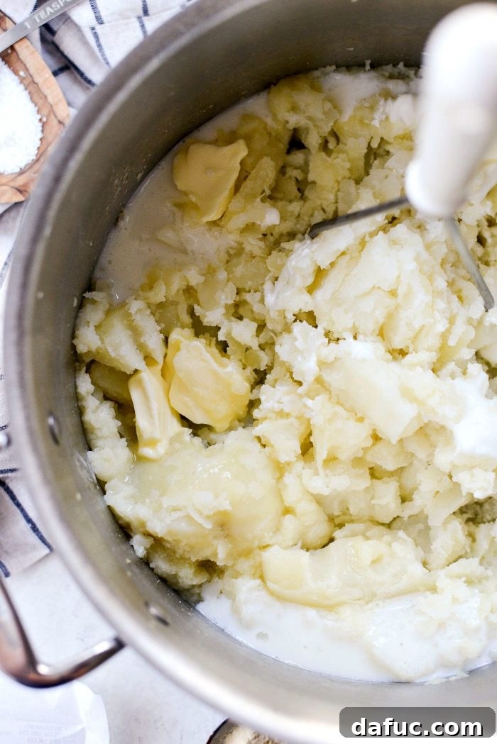 Buttermilk Cauliflower Mashed Potatoes l SimplyScratch.com #cauliflower #mashedpotatoes #potatoes #light #buttermilk #sidedish #homemade #fromscratch #easy