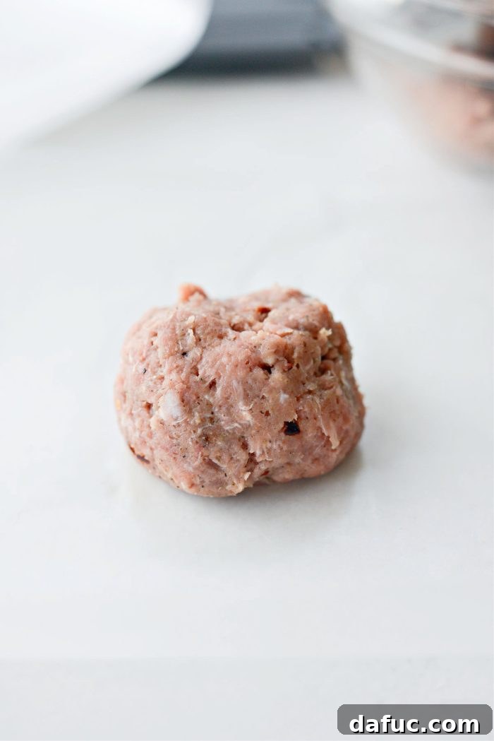 Hearty Sausage Egg and Cheese Breakfast Melts 11 Measuring out 1/3 cup turkey sausage mixture