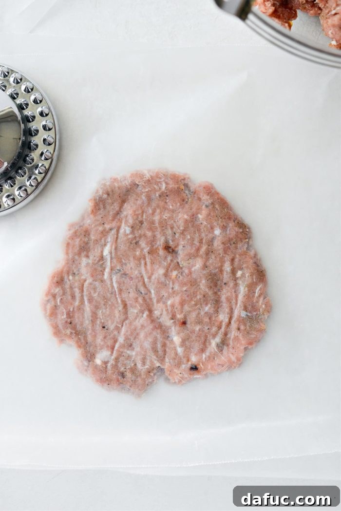 Hearty Sausage Egg and Cheese Breakfast Melts 13 Flattened turkey sausage patty ready for cooking