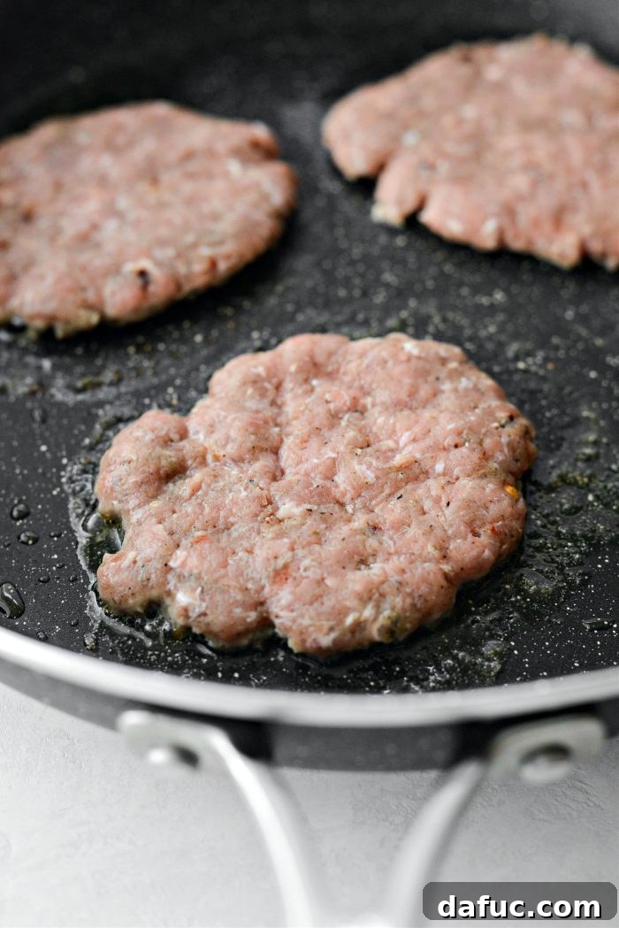 Hearty Sausage Egg and Cheese Breakfast Melts 14 Frying turkey sausage patties in a skillet