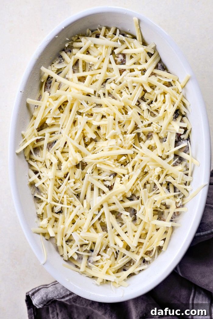 Hearty Mushroom Wild Rice Bake 12 Mushroom Wild Rice Casserole bubbling out of the oven, before final cheese topping.